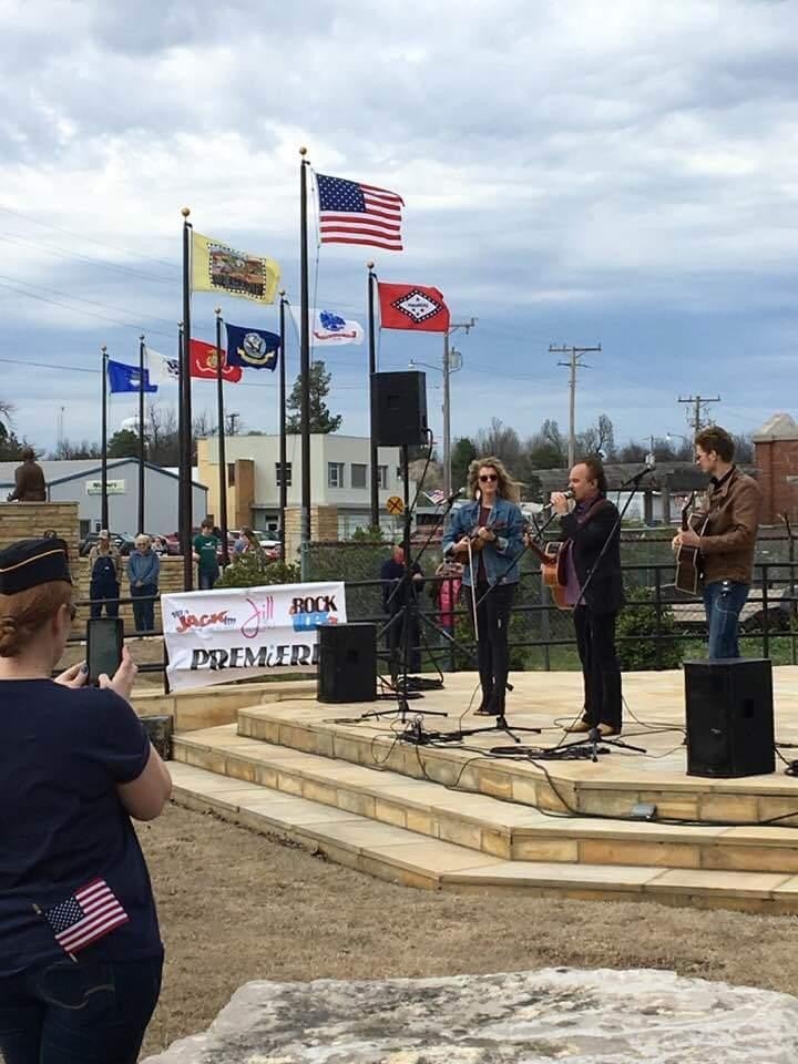 a person in a military uniform holding a flag