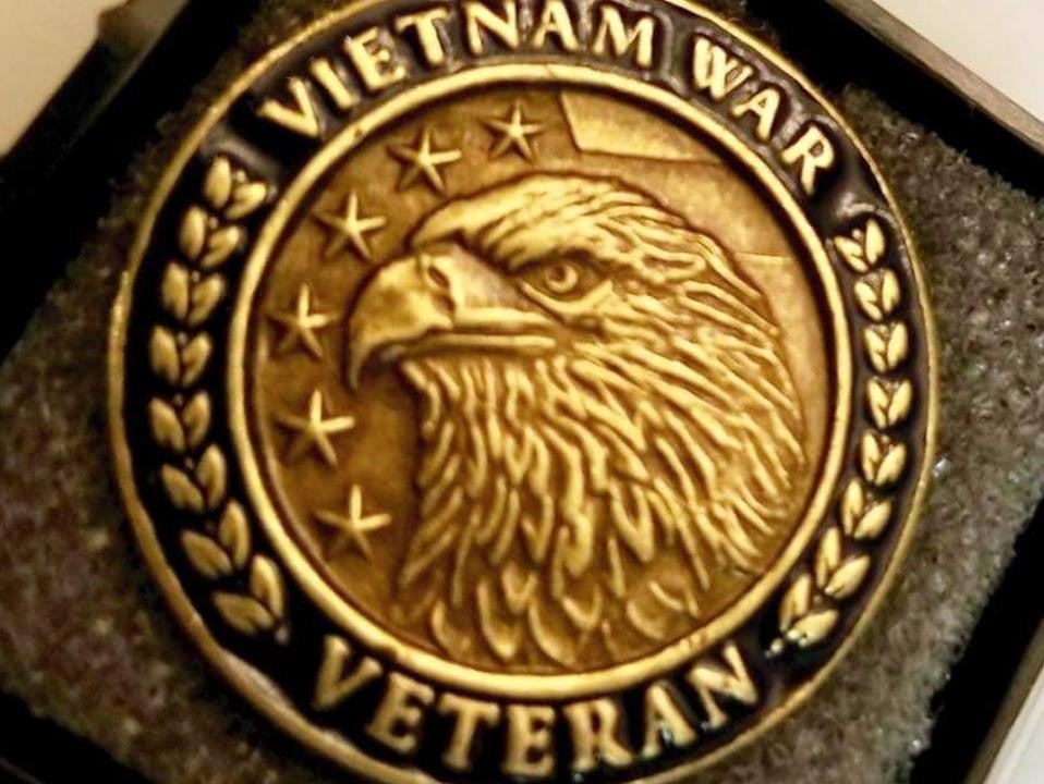 a gold colored commemorative coin